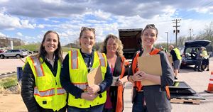 Volunteers wearing safety vests at outdoor event