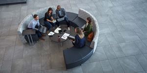 Employees gathered around a round table