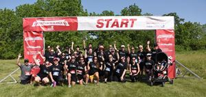 Running team poses at starting line