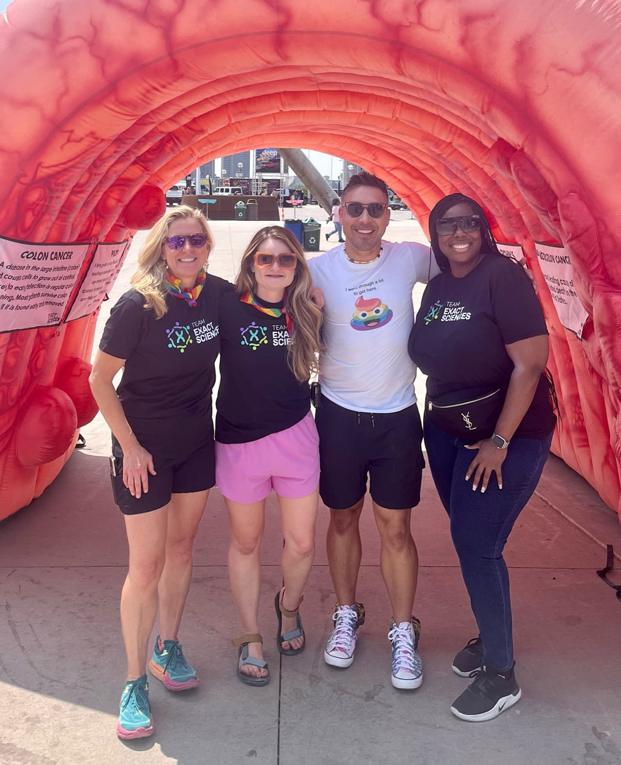 Four Exact Sciences associates smiling at a team event.