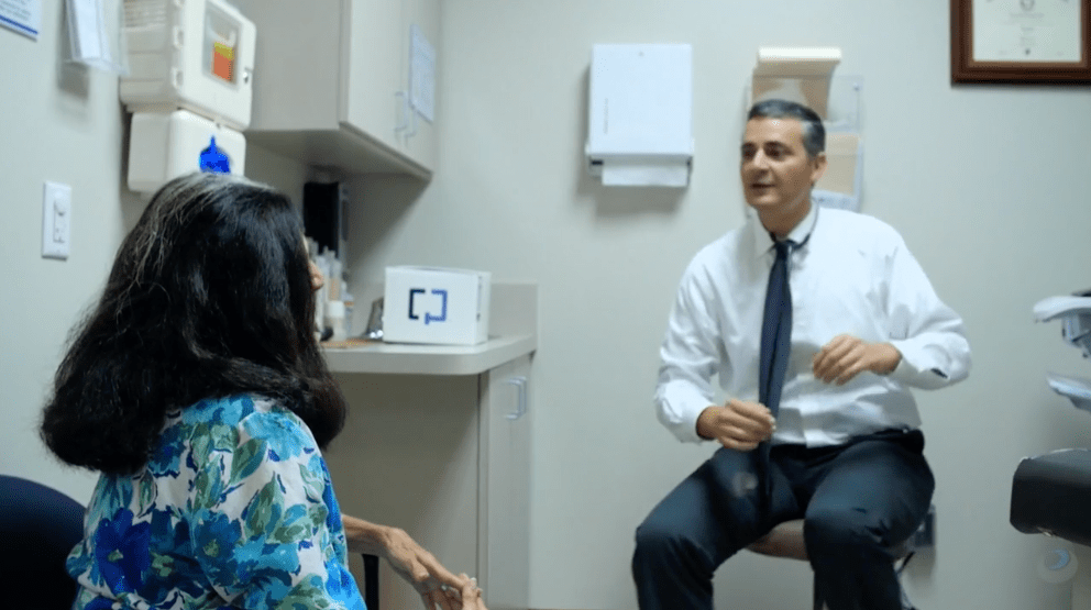 A doctor and patient at a medical appointment A doctor and patient at a medical appointment