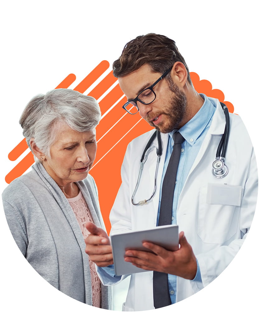 A doctor showing a patient their test results on a tablet.