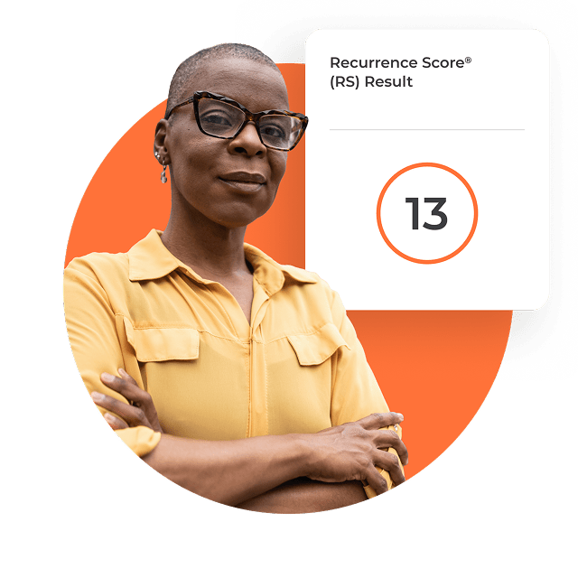 A woman standing next to a card displaying a test score of 13.