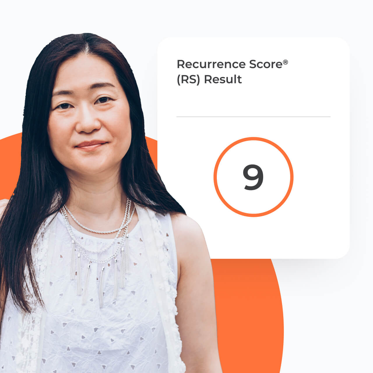 A woman standing next to a card with a test score of 9.