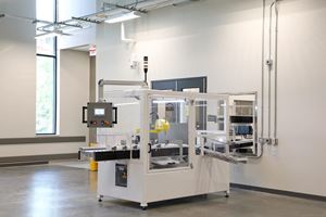An automated box cutter opens samples returning to the lab.