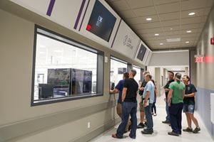 After the grand opening ceremony, guests toured the laboratory facility to get a first-hand look at the company's laboratory operations.