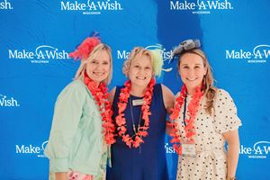 Two Exact Sciences team members pose with Make-A-Wish Wisconsin CEO Wendy Cozzens at Wishes By the Bay.